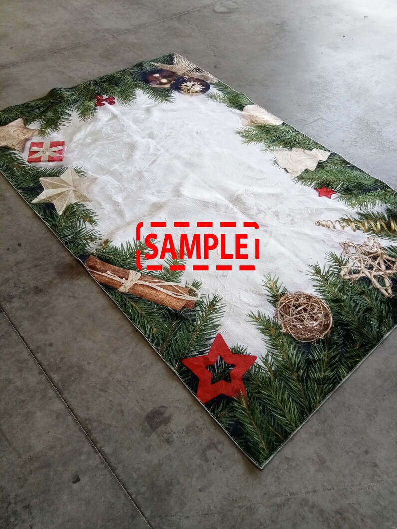 May include: A rectangular Christmas-themed table runner with a white center and a border of green pine needles. The border is decorated with red stars, gold ornaments, and cinnamon sticks. The word "SAMPLE" is printed in red.
