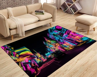 May include: A black area rug with a neon city scene. The rug features bright pink, blue, green, and yellow neon lights. The rug is perfect for adding a modern and stylish touch to any room.