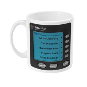 May include: White ceramic mug with a black panel design featuring a blue screen with text. The screen displays "Friday Qualifying", "Remenham Roar", and other options. The mug also has the text "Eclectica" and "Designed Differently".