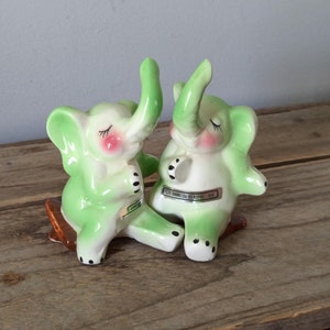 Anthropomorphic happy hugging elephant salt and pepper shakers, Kitsch Vintage Table Decor