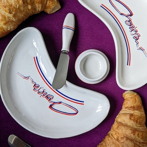 Rare vintage 1980’s set of croissant shaped plates set including 2 plates, 2 butter dishes and 2 knives. Breakfast serving plates French