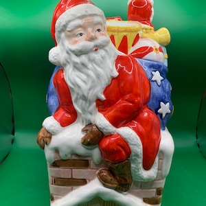 Keramische koektrommel voor de kerstman: tas met schoorsteen en speelgoed