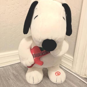 Hallmark Peanuts Merry Rockin' Christmas Snoopy Interactive Stuffed Animal