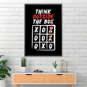 May include: Black and white motivational poster with the text "Think outside the box" and a tic-tac-toe game with a red line drawn through it.