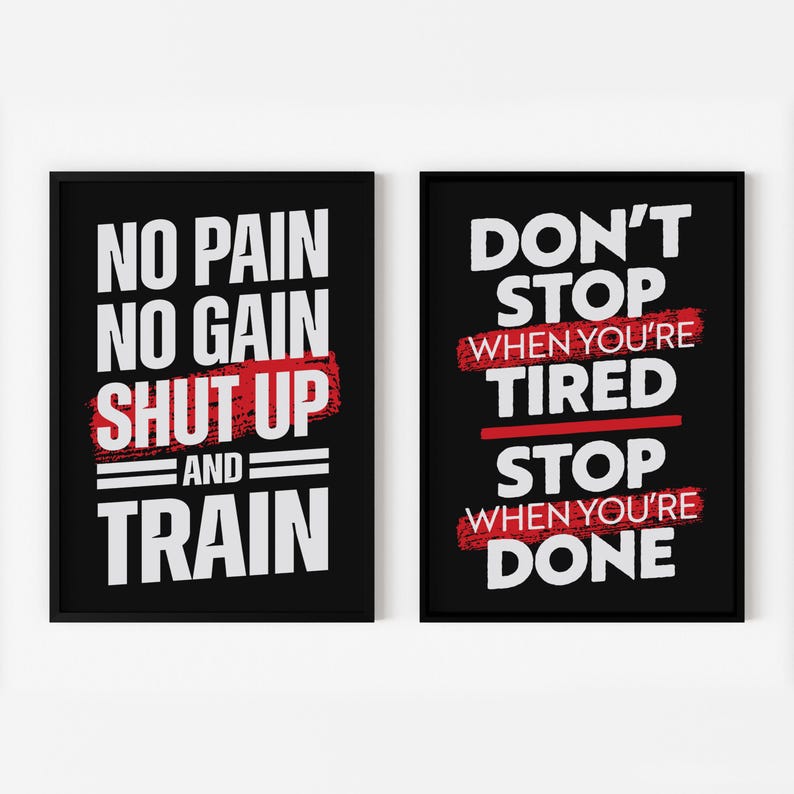 May include: Two black framed motivational posters with white text and red accents. The left poster says "No pain no gain shut up and train". The right poster says "Don't stop when you're tired stop when you're done".