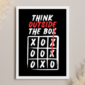 May include: Black and white motivational poster with the text "Think Outside The Box" in red and white. A white tic-tac-toe board with a red line drawn through it.