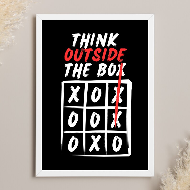 May include: Black and white motivational poster with the text "Think Outside The Box" in red and white. A white tic-tac-toe board with a red line drawn through it.