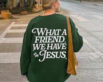 May include: A dark green sweatshirt with the text "WHAT A FRIEND WE HAVE IN JESUS" printed in white on the back.