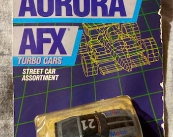 Tomy AFX Turbo Slot Car - Corvette plateado n.° 21