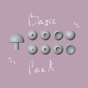 Puede incluir: Un conjunto de ocho puntas de auriculares grises, etiquetadas como "Basic Pack". Las puntas son de varias formas y tamaños, incluida una punta con forma de hongo.