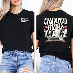 May include: Black t-shirt with a white graphic on the front that says "CT* TECHNOLOGIST". The back of the shirt has a white graphic that says "COMPUTED *AXIAL* TOMOGRAPHY" with a red radiation symbol and the text "RADIATE POSITIVITY DONUT OF TRUTH ALARA KUP MAS NOUNSFIELS RADIOLOGY DEPARTMENT".