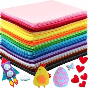 May include: A stack of colorful felt sheets in various colors, including pink, red, orange, yellow, green, blue, and purple. Also included are felt craft items: a rocket, a chicken, an egg, a butterfly, and red hearts. Ideal for crafting projects.