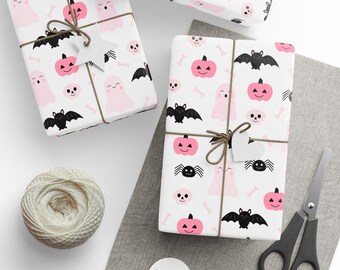 Roze Halloween-inpakpapier: geesten, pompoenen, vleermuizen