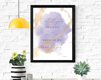 May include: A framed print with a watercolor background in shades of purple and gold. The print features a quote from 1 Peter 5:7, "Cast all your anxiety on Him because He cares for you."