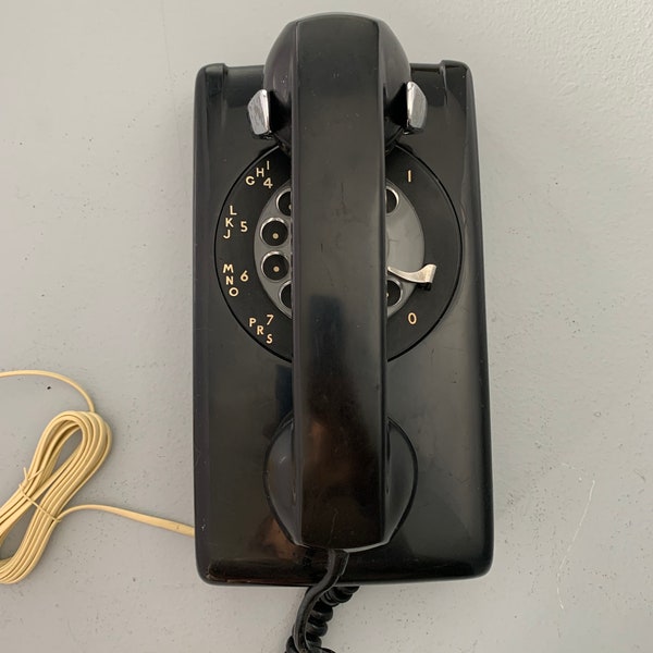 Classic Black Rotary Dial Kitchen Wall Phone. Works great, clear ringing and smooth dialing.