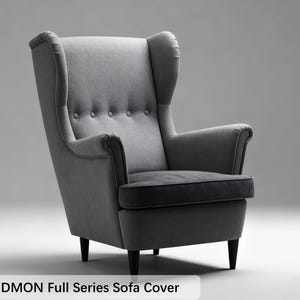 May include: A gray upholstered armchair with a high back and button detailing. The chair has a cushioned seat and armrests, and is supported by four dark wooden legs. The text "STRANDMON Full Series Sofa Cover" is at the bottom.
