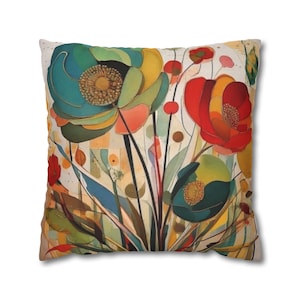 May include: Square cushion with a vibrant floral pattern. The design includes large flowers in teal, red, yellow, and orange, with black stems and green leaves. The background features a mix of light colours and geometric shapes.