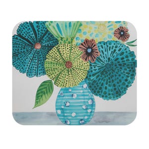 May include: A watercolor illustration of a floral arrangement in a blue vase. The flowers are in shades of teal, yellow, and pink, with a green leaf. The vase has blue stripes and white polka dots. The background is white.