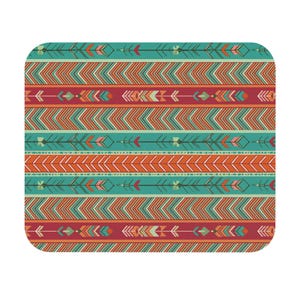 May include: Rectangular decorative mat with a Southwestern-inspired pattern. The design features horizontal bands of teal, orange, and burgundy with arrow and geometric motifs. The mat has rounded corners and a white background.