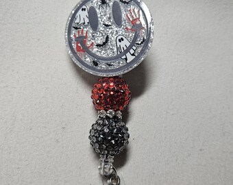 Badge reel spooky happy face
