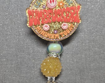 Badge reel yellow dumb happy face