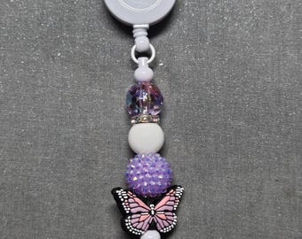 Badge reel purple butterfly