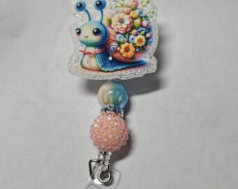 Badge reel spring snail