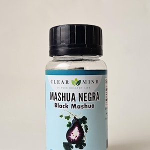 May include: A clear plastic bottle with a black lid, labeled "CLEAR MIND" and "MASHUA NEGRA Black Mashua." The label features a purple illustration of a plant and states "100 CAPSULES | 450 MG DIETARY SUPPLEMENT."