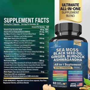 May include: A black supplement bottle with a blue label, featuring text about sea moss, black seed oil, ginger, burdock, and ashwagandha. The label also lists ingredients and the words "All in 1 Supplement" and "Extra Strength". The bottle contains 60 veggie capsules.