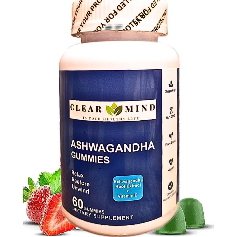 May include: A white bottle of Clear Mind Ashwagandha Gummies with a blue label. The label includes text such as "Ashwagandha Gummies", "Relax, Restore, Unwind", and "60 Gummies". The bottle is accompanied by strawberries and green gummy candies.