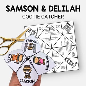 May include: A white Samson & Delilah cootie catcher with illustrations and text, including the words "Samson," "Delilah," "Hair," and "Temple." Gold scissors are positioned next to the cootie catcher.