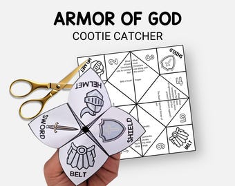 May include: A white paper "Armor of God" cootie catcher with illustrations of a helmet, sword, shield, and belt. Gold scissors are next to the folded paper. The text "Armor of God" and "Cootie Catcher" are at the top.