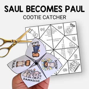 May include: A white paper cootie catcher with the text "SAUL BECOMES PAUL" and illustrations of Jesus, Saul, and Damascus. Gold scissors are next to the cootie catcher.
