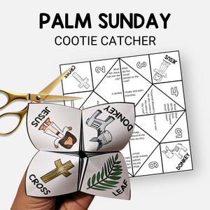 May include: A white Palm Sunday cootie catcher with illustrations of Jesus, a cross, a donkey, and palm leaves. Gold scissors are placed on top of the folded paper game. The text "Palm Sunday Cootie Catcher" is at the top.