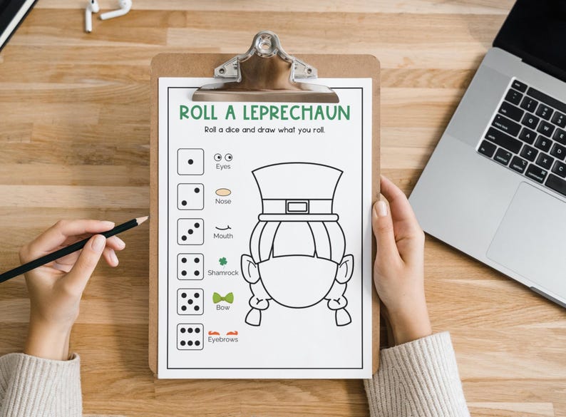 May include: A printable game sheet with instructions to "Roll a dice and draw what you roll". The sheet features a leprechaun with a hat and beard, and a list of body parts to draw, including eyes, nose, mouth, shamrock, bow, and eyebrows.