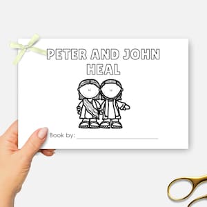 May include: A white card with the text "PETER AND JOHN HEAL" and an illustration of two figures. The card is held by a hand and has a light green bow. Gold scissors are in the bottom right corner.