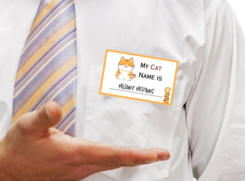 May include: A yellow name tag with a cartoon orange cat and the text "My Cat Name Is Meowy Mcpaws".