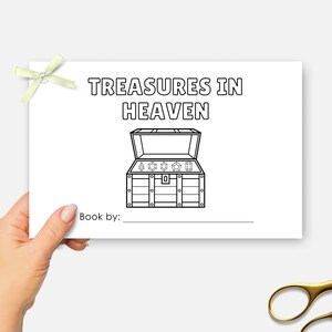 May include: A white card with the text "TREASURES IN HEAVEN" above a treasure chest illustration. The card has a light green bow and the words "Book by:" with a blank line below. Gold scissors are in the bottom right corner.