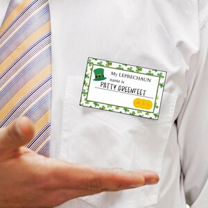 May include: A white shirt with a yellow and blue striped tie. A name tag with green shamrocks and gold coins reads "My Leprechaun name is PATTY GREENFEET".