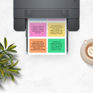 May include: Four colorful sticky notes with text printed on them. The notes are printed with different sayings about different objects. The notes are on a white surface with a printer and a cup of coffee.