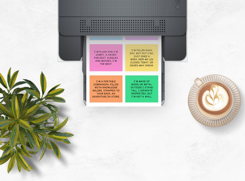 May include: Four colorful sticky notes with text printed on them. The notes are printed with different sayings about different objects. The notes are on a white surface with a printer and a cup of coffee.