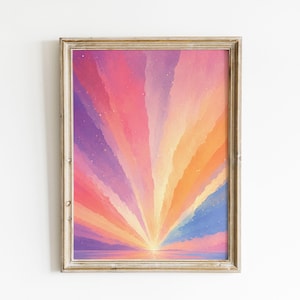 May include: A framed vertical wall art print featuring a vibrant sunrise or sunset with radiating beams of color including purple, pink, orange, and yellow. The scene depicts a horizon line over water with a soft, painterly texture and small stars.