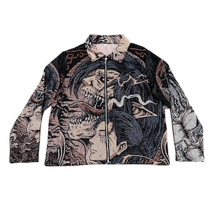 May include: A black zip-up jacket featuring a colourful, graphic print of a skull and other fantasy creatures. The print is detailed and intricate.