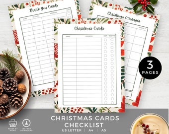 May include: Three printable checklist pages for Christmas cards, thank you cards, and messages. Each page features a festive border of red berries and green leaves. The sheets include columns for names, addresses, and checkboxes for tracking status.