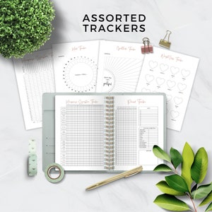 May include: Assorted printable trackers for habit tracking, mood tracking, weight loss, gratitude, and period tracking. The trackers are in black and white with a pink title.