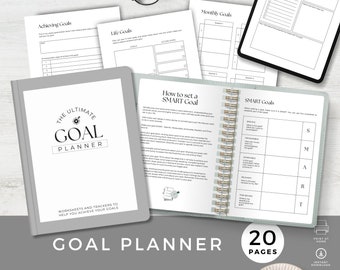 May include: A gray and white goal planner with the title "The Ultimate Goal Planner" and the text "Worksheets and trackers to help you achieve your goals". The planner has a spiral binding and includes a section on how to set a SMART goal.