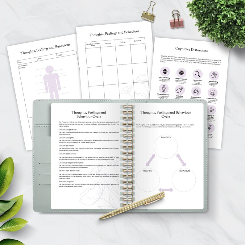 May include: A green and white spiral bound journal with the title "Thoughts, Feelings and Behaviour Cycle" on the cover. The journal is open to a page with a diagram of a cycle with the words "Thoughts", "Feelings", and "Behaviours" in circles. The journal is on a white surface with a gold pen.