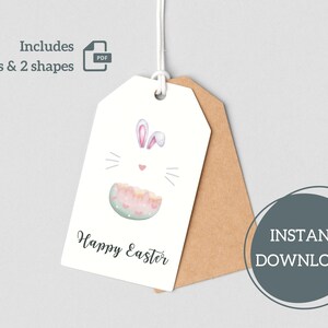May include: A white gift tag with a bunny rabbit illustration and the text "Happy Easter". The tag is hanging from a brown string and has a brown paper backing.