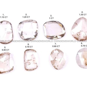 May include: Eight loose, faceted, translucent, light-colored gemstones arranged in two rows. Each stone is numbered 1 through 8 with its corresponding weight in carats (CT) printed above it, ranging from 0.60 CT to 1.30 CT. The text OWNGEMSWORLD repeats.