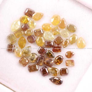 Natural Rustic Yellow & Brown Diamond Lot, Mixed Shape Rose Cut Loose Diamonds, Real Earth-Mined Stones for Custom Jewelry
brilliant cut diamonds, mixed color diamonds, brown brilliant diamond, salt and pepper diamonds, fancy color loose diamonds, wholesale diamond lot, loose diamonds for jewelry, handmade jewelry supplies, mixed brilliant cut gems, rustic round diamonds, jewelry designers diamonds, fine jewelry stones, wholesale gemstone supply, brilliant cut diamond mix